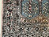 an image of a rug on the floor with a cat laying on top of it