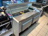 an image of a commercial kitchen with stainless steel counter tops and stainless steel counter tops