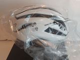 a helmet that is wrapped in plastic on a table