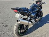 a motorcycle that is parked on the side of the road