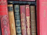 a box full of old books sitting on a table