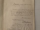 un vieux document sur lequel figure la photo d'un homme et d'une femme