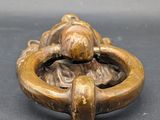 a close up of a metal ring with a dog on it