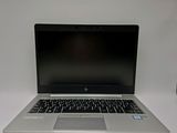 an open laptop computer sitting on top of a white table