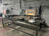 a table that has some tools on it in a garage