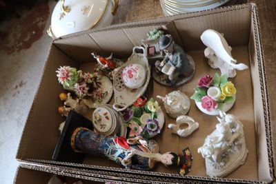 a cardboard box with a bunch of different items in it