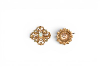 a pair of gold earrings with oplites and diamonds