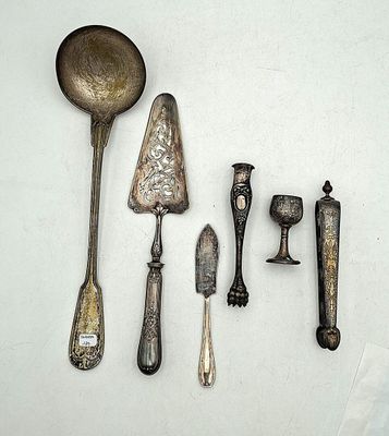 a lot of silver spoons and spoon spoons on a white surface