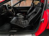 a red car with black leather seats in the back of it