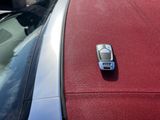a cell phone on the hood of a car