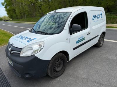 a white van that is parked on the side of the road