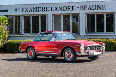 an image of a red car parked in front of a building