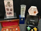 several different types of perfumes are displayed in a display case