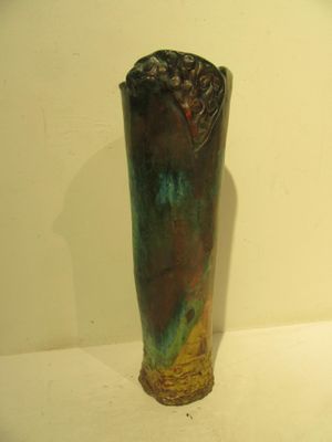 two vases sitting on a shelf in a room