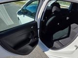 a white car with its door open in the parking lot