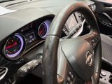 a steering wheel and dashboard of a car at a car show