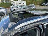 many cars parked in a parking lot next to each other