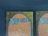 two decks of magic the gathering are shown on a table