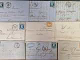 many old envelopes that are on a table