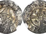 a silver coin with an image of a man and a cross on it