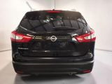 the back end of a black nissan suv parked in a garage