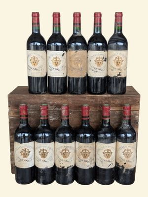 several bottles of wine are lined up on a wooden shelf