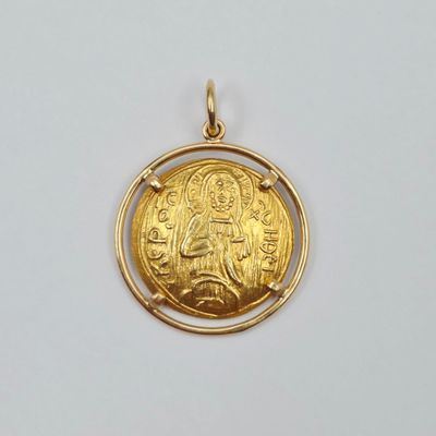 une image représentant une pièce d'or sur laquelle figure le portrait d'une femme
