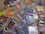 many different types of pokemon cards laid out on a table