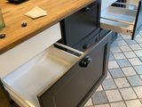 a kitchen island with two drawers on it