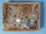 a box full of empty glassware on a blue surface
