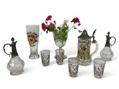 many different vases and vases with flowers in them