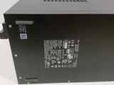 the back of a black power supply unit on a white surface