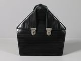 black leather briefcase with silver handles on a white surface
