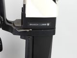 an image of a close up of a microscope on a table