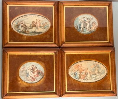 four framed pictures of a group of people on a wall