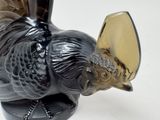 a black bird with a mirror on it ' s head