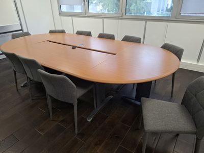 an image of a conference table and chairs in a room