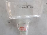 a clear cup with a lid sitting on a counter