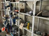 a room filled with lots of shelves with tools on them