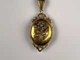an image of a gold locke with a picture of a woman on it