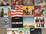 a lot of various album covers on the floor