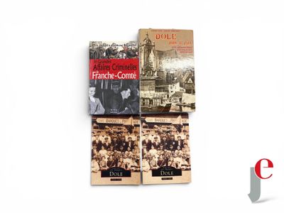 three books on a white surface with a picture of a clock tower in the background