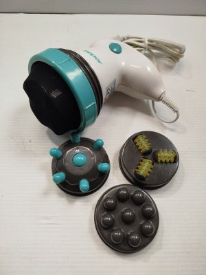 a toy blow dryer sitting on a table next to some buttons