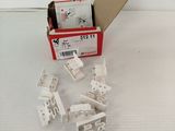 a box of white electrical components sitting on a white surface