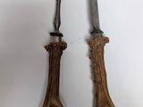 two forks and a knife with antlers on them