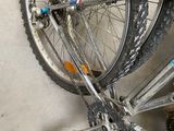 a close up of a bicycle that is parked in a garage