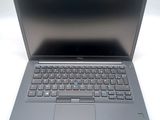 an open laptop computer sitting on top of a white table