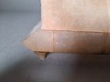 a piece of cardboard sitting on top of a piece of wood