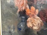 a painting of flowers in a blue vase on a table
