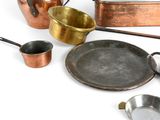 many different types of pots and pans on the table